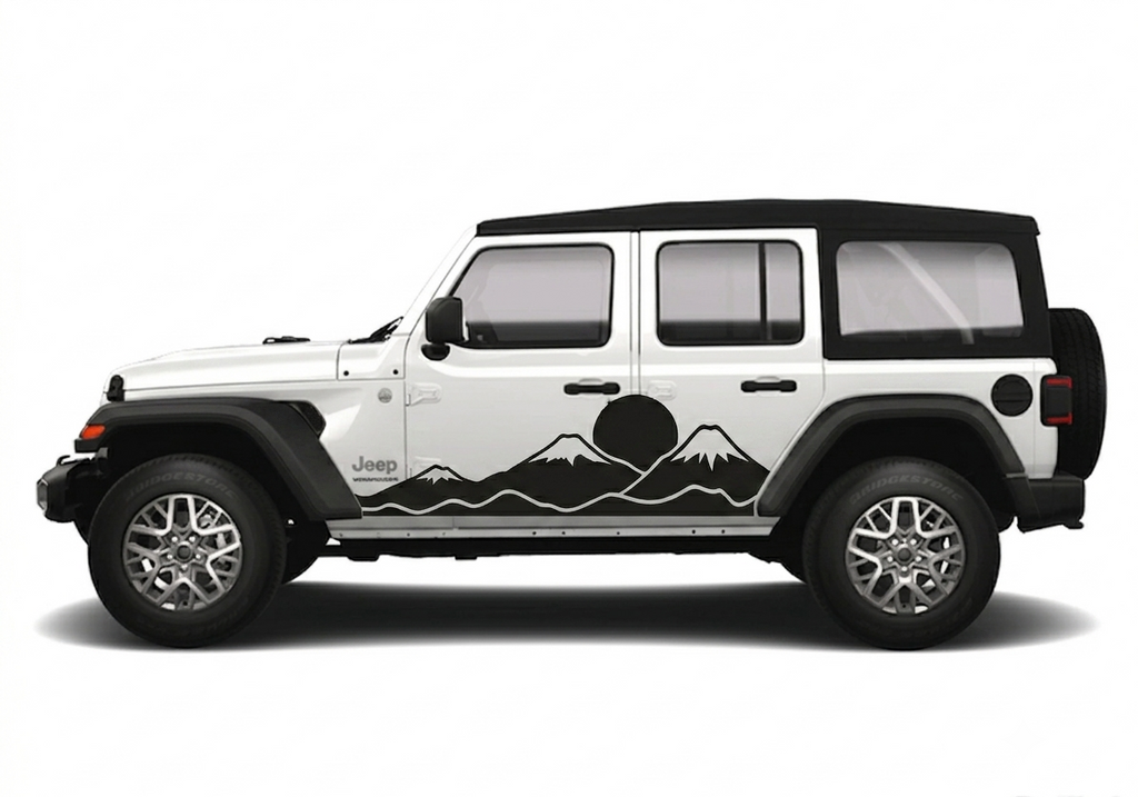 A white Jeep Wrangler with a black mountain and sun graphic decal applied along the side, shown in profile against a plain white background.