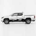 A white pickup truck shown in side profile on a clean light gray studio background, with a black and white flame-style decal applied along the lower side panel. The truck bed is covered by a dark tonneau, and the wheels are silver.