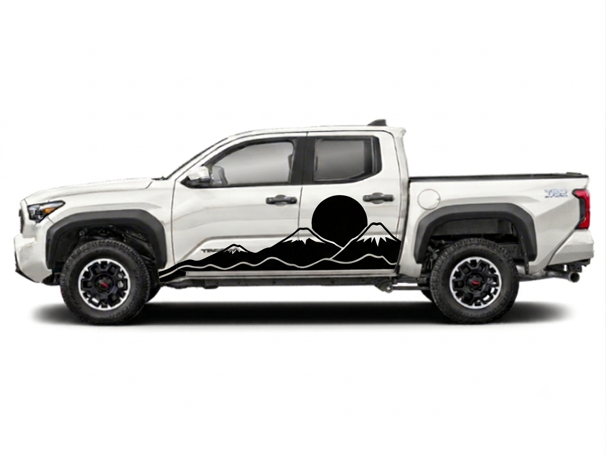 A white Toyota Tacoma pickup truck shown in side profile on a light gray background, featuring a black mountain and sun graphic decal along the lower side panel.
