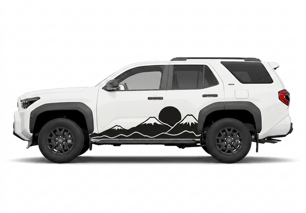 A white SUV shown in side profile on a light gray studio background, featuring a black mountain-and-sun graphic decal running along the lower side panel.